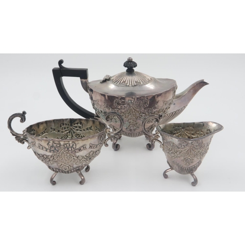 114 - Victorian hallmarked silver heavily embossed Victorian tea service, each piece raised on scrolling s... 