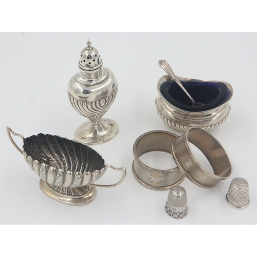 133 - Group of hallmarked silver items, pepperette, mustard pot and spoon small open salt, two napkin ring... 