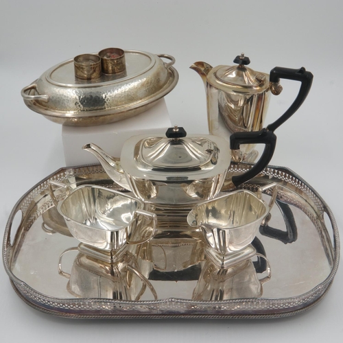 141 - Silver plated galleried tray with a silver plated four piece tea service, covered serving dish with ... 