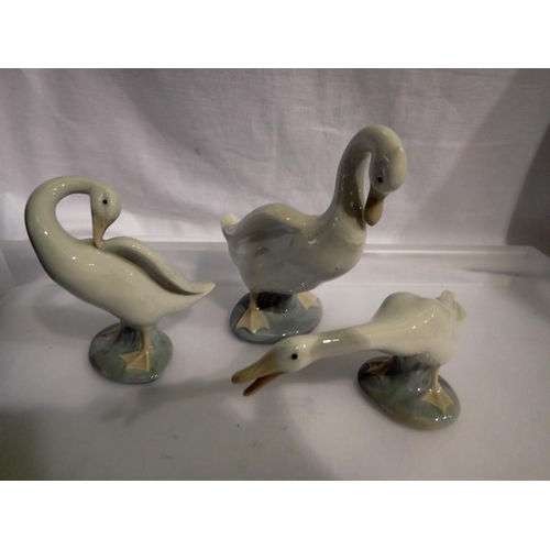 1304 - Three Nao and Lladro duck figurines. Not available for in-house P&P