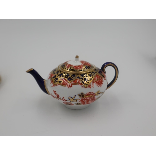 218 - Royal Crown Derby Old Imari pattern bowl with a miniature Old Imari pattern teapot (2), both in good... 