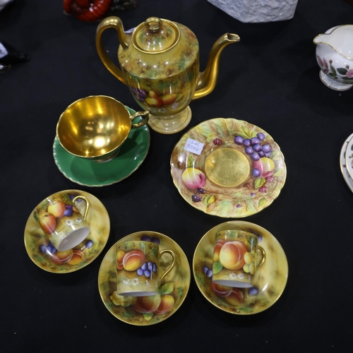 252 - Aynsley Orchard Gold tea trio, cup and side plate signed D. Jones and N. Blunt with a coffee pot and... 