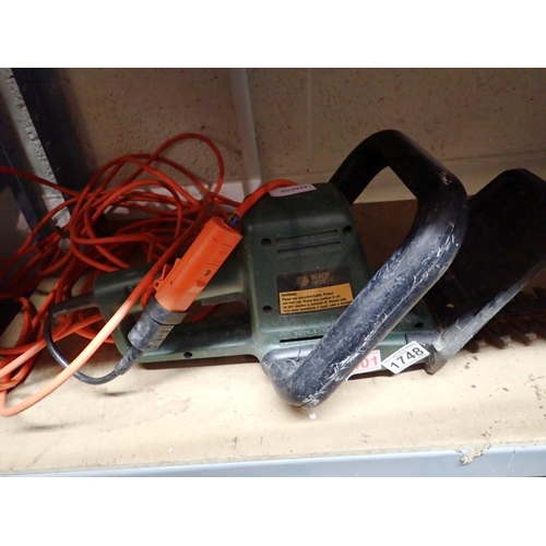 1748 - Black & Decker hedge trimmer, with bag and lead. All electrical items in this lot have been PAT test... 