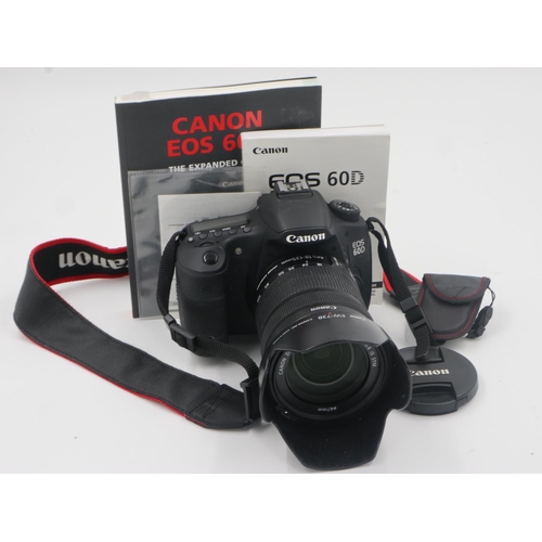 165 - Canon EOS 60D digital camera with a Canon EFS 18-135mm lens and booklets, charger present. UK P&P Gr... 