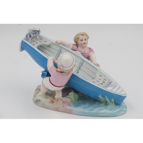 192 - Continental figure of two boys pushing a boat, H: 18cm. UK P&P Group 3 (£30+VAT for the first lot an... 