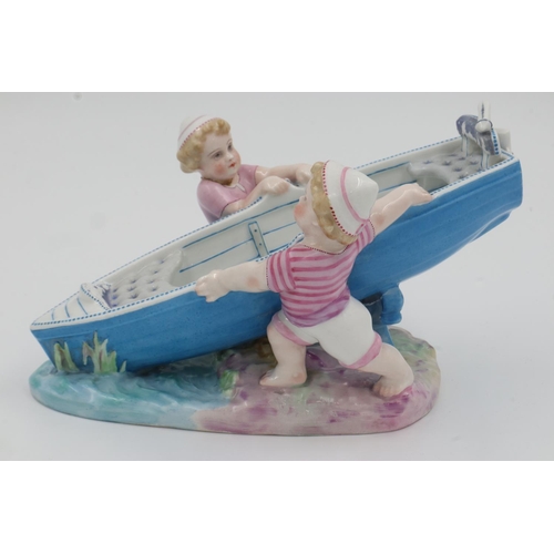 192 - Continental figure of two boys pushing a boat, H: 18cm. UK P&P Group 3 (£30+VAT for the first lot an... 