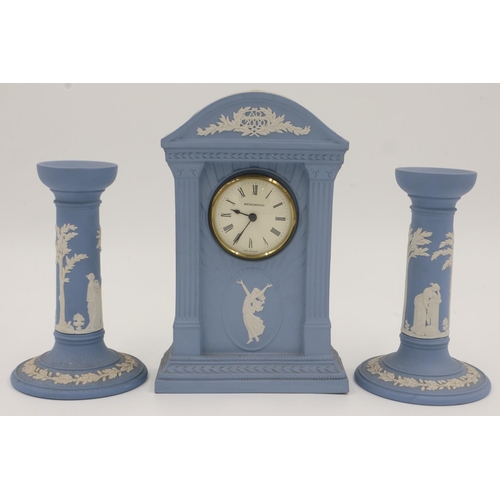 199 - Wedgwood blue Jasperware mantel clock with a pair of candlesticks, height of tallest 22cm. UK P&P Gr... 