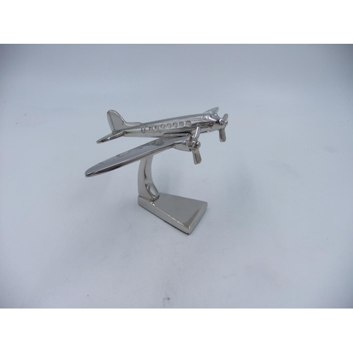 321 - Chrome Dakota aeroplane on stand. H: 13cm. UK P&P Group 1 (£16+VAT for the first lot and £2+VAT for ... 