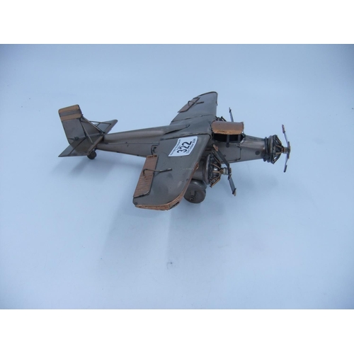 322 - Tin plate three engine plane. H: 9cm. UK P&P Group 2 (£20+VAT for the first lot and £4+VAT for subse... 