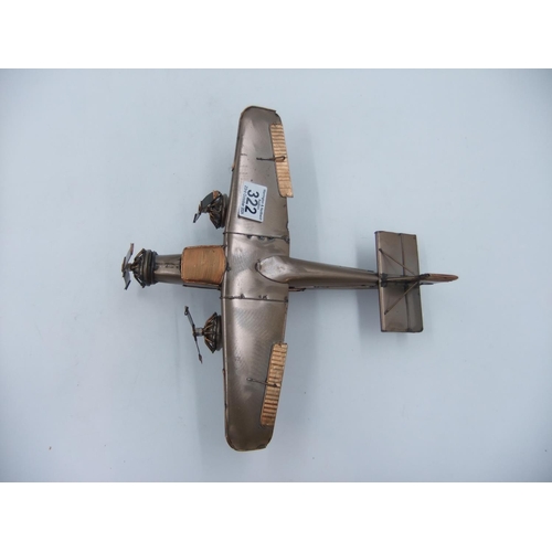 322 - Tin plate three engine plane. H: 9cm. UK P&P Group 2 (£20+VAT for the first lot and £4+VAT for subse... 