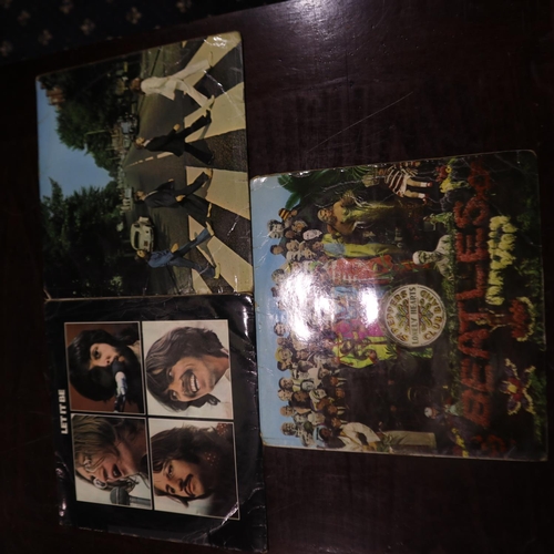 390 - Three The Beatles albums, Let It Be, Abbey Road and Sgt Peppers Lonely Hearts Club Band. UK P&P Grou... 