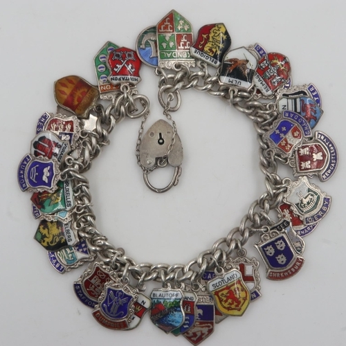 34 - Silver charm bracelet with 34 place name silver charms, 62g. UK P&P Group 0 (£6+VAT for the first lo... 