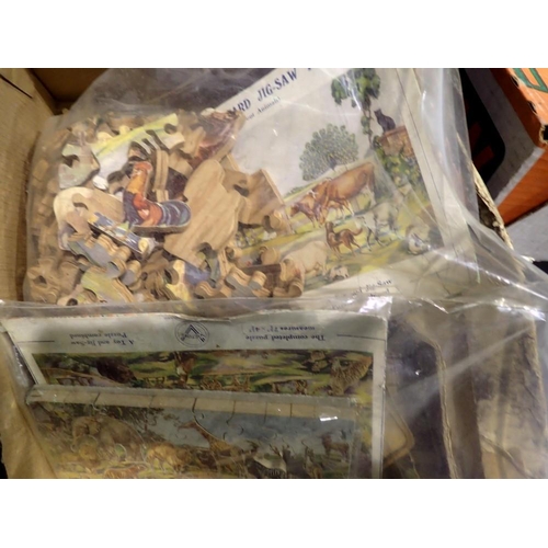 1047 - Four vintage wooden jigsaws, contents unchecked. Not available for in-house P&P