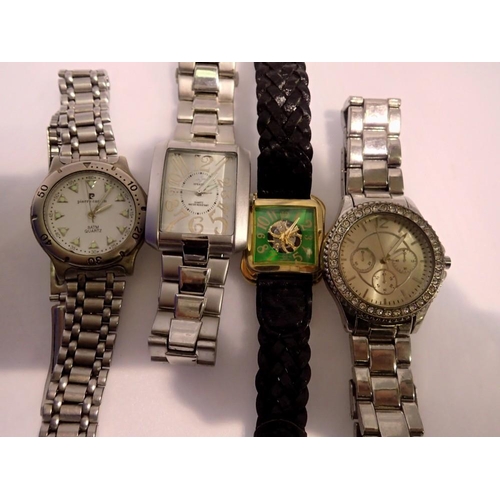 1052 - Four gents quartz wristwatches, including Pierre Cardin and Speatak, all working at lotting up. UK P... 