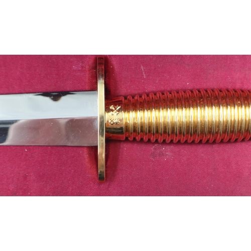 2177 - Presentation Commando Dagger in ornate fitted box, gold plated grip and steel blade. Not available f... 