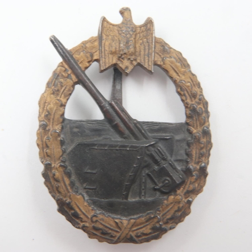 2239 - WWII German Kriegsmarine Coastal Artillery Badge. Marked “65” in a diamond shaped box for the Klein ... 