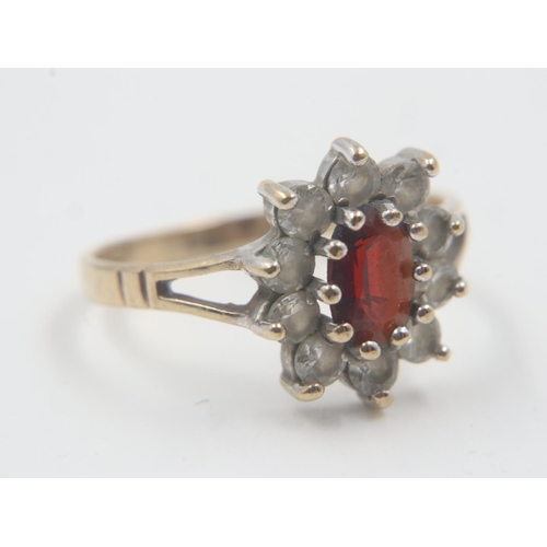 42 - Ladies 9ct gold dress ring set with garnet and CZ, size J, 1.46g. UK P&P Group 0 (£6+VAT for the fir... 