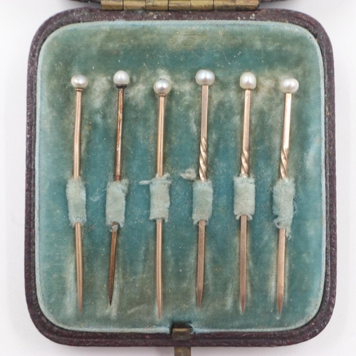 46 - Two sets of three unmarked gold stick pins, pearl-set, combined 2.4g, within a fitted case. UK P&P G... 