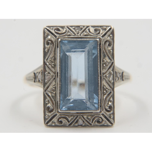 58 - 1920s cocktail ring, set with a large emerald-cut aquamarine surrounded with diamond chips, in a pla... 