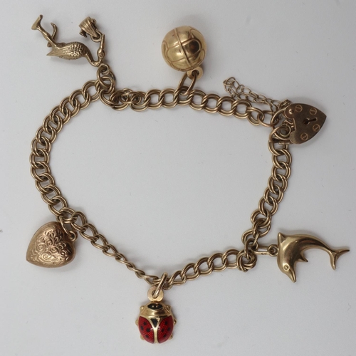 76 - 9ct gold charm bracelet, with five charms, 9.3g. UK P&P Group 0 (£6+VAT for the first lot and £1+VAT... 