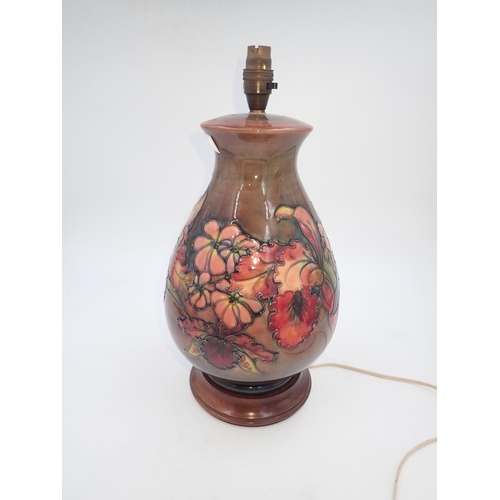 198A - Large Moorcroft flambe lamp in the Orchid pattern. All electrical items in this lot have been PAT te... 