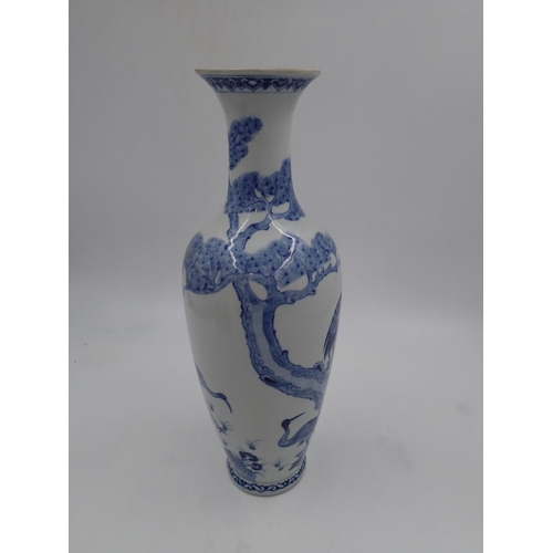 239 - Large Oriental blue and white vase decorated with storks, H: 46cm. In good order with no issues note... 