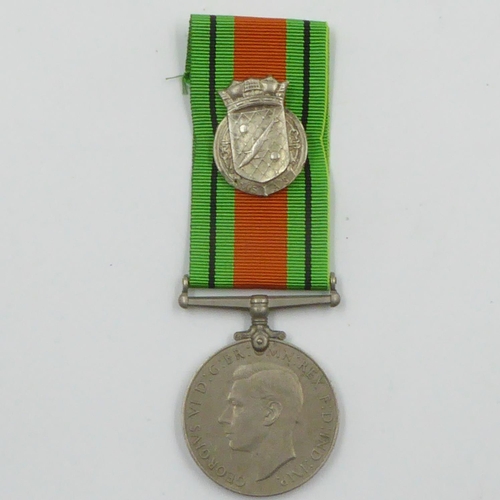 2293 - WWII British Defence Medal with a Silver Royal Navy Patrol Pin. The pin was normally given to Britis... 