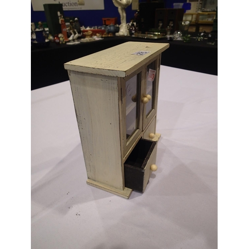 275 - Miniature kitchen cupboard. H: 26cm. UK P&P Group 3 (£30+VAT for the first lot and £8+VAT for subseq... 