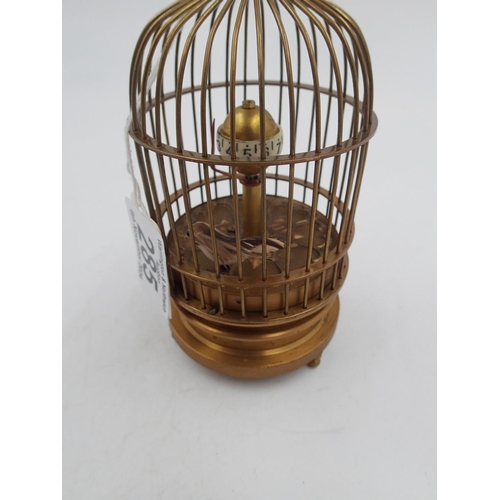 285 - Brass bird cage mechanical clock. H: 14cm. UK P&P Group 2 (£20+VAT for the first lot and £4+VAT for ... 