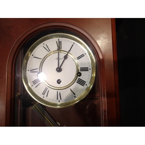 291 - Mahogany cased Hermle wall clock. Not available for in-house P&P