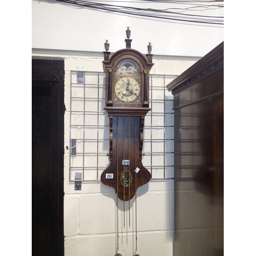 292 - Walnut wall clock with moon phase and painted dial depicting sail boats windmill and flora, with key... 