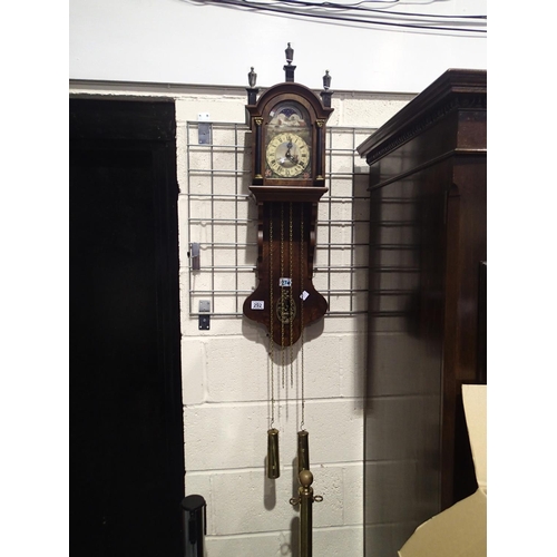 292 - Walnut wall clock with moon phase and painted dial depicting sail boats windmill and flora, with key... 