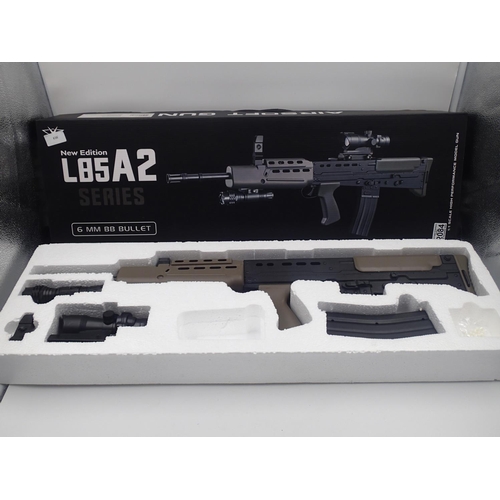 2084 - New spring powered 6mm BB rifle in black/green (L85 A1 style), boxed. UK P&P Group 3 (£30+VAT for th... 