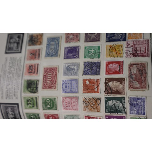 113 - Meteor stamp album of world stamps, with a Lincoln stamp album and a binder of Royal Mail collectors... 