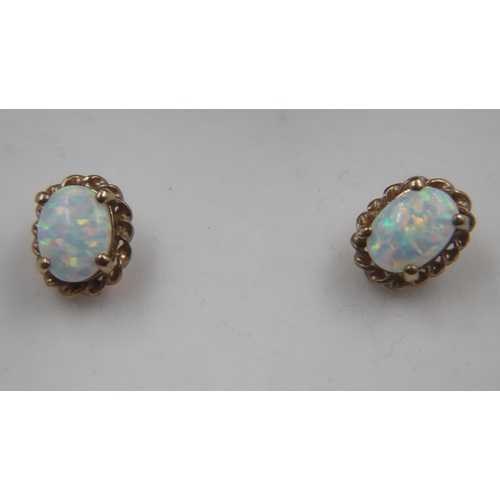 24 - 9ct gold opal stud earrings with butterfly clasps present, 1.2g. UK P&P Group 0 (£6+VAT for the firs... 