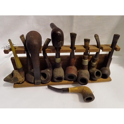 Eleven classic wooden pipes and a pipe stand. UK P&P Group 2 (£20+VAT ...