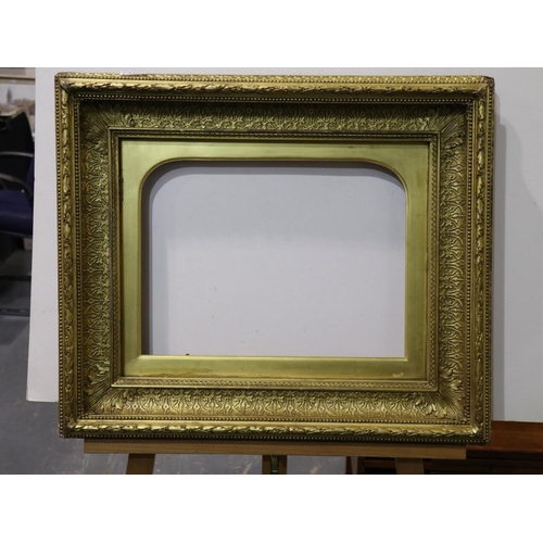 2071 - Late 18th / early 19th century heavily moulded gilt wood and plaster frame, with arched mount, inter... 