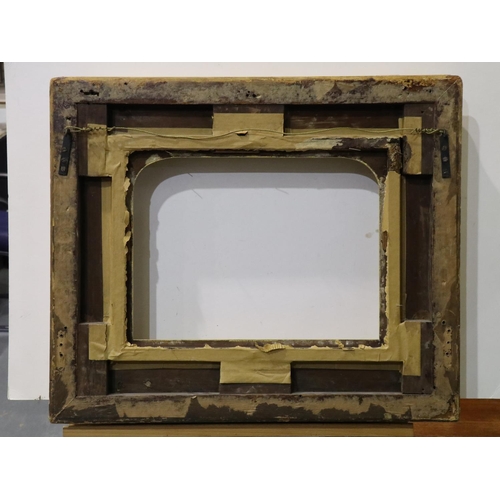 2071 - Late 18th / early 19th century heavily moulded gilt wood and plaster frame, with arched mount, inter... 