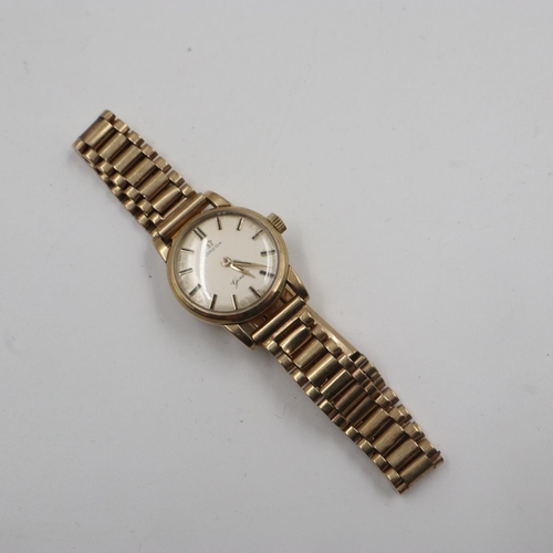 87 - OMEGA: ladies 9ct gold cased wristwatch, on a 9ct gold bracelet, working at lotting up. UK P&P Group... 