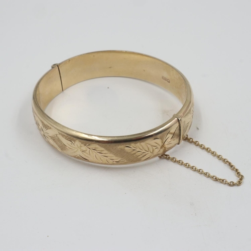 66 - 9ct gold bangle with safety chain, 16.3g. UK P&P Group 1 (£16+VAT for the first lot and £2+VAT for s... 