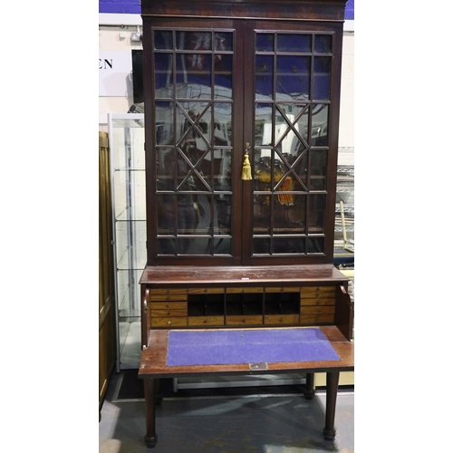 2135 - A monumental 19th century secretaire, the single fitted drawer sits on four turned supports and bene... 