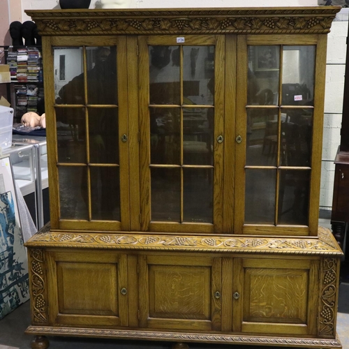 2136 - Substantial oak glazed bookcase with cupboards below and grapevine carved decoration, 160 x 45 x 185... 