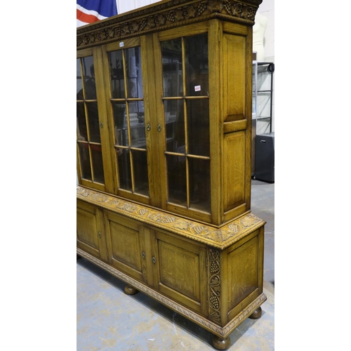 2136 - Substantial oak glazed bookcase with cupboards below and grapevine carved decoration, 160 x 45 x 185... 