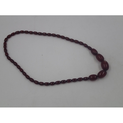 20 - Cherry amber graduated bead necklace, largest bead L: 28 mm, 39g, condition good. UK P&P Group 0 (£6... 