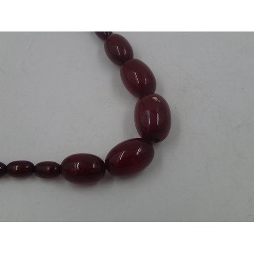 20 - Cherry amber graduated bead necklace, largest bead L: 28 mm, 39g, condition good. UK P&P Group 0 (£6... 