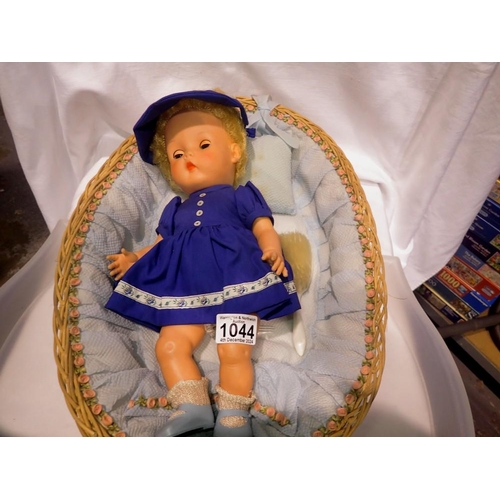 1044 - Cinderella doll with sleeping eyes in a floral basket. Not available for in-house P&P