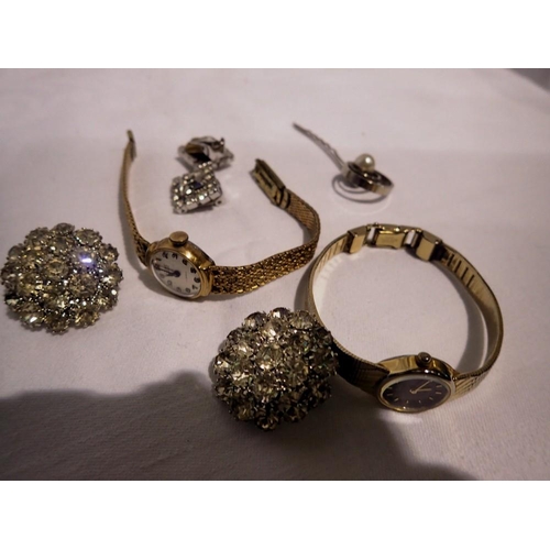 1064 - Two ladies wristwatches, a pin and two pairs of Diamante earrings. UK P&P Group 1 (£16+VAT for the f... 