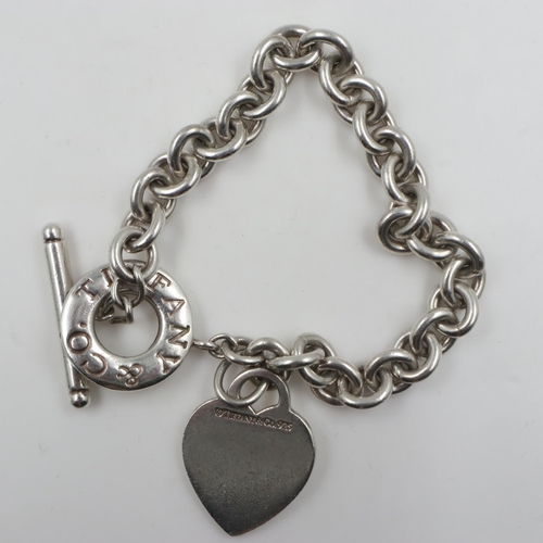 11 - Tiffany and Co 925 silver charm bracelet, 38g. UK P&P Group 0 (£6+VAT for the first lot and £1+VAT f... 