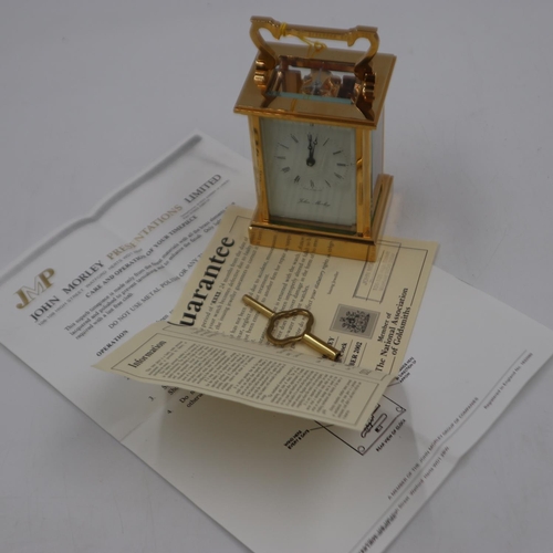 399 - JOHN MORLEY: brass carriage clock with original box, key and paperwork, H: 15 cm. UK P&P Group 2 (£2... 