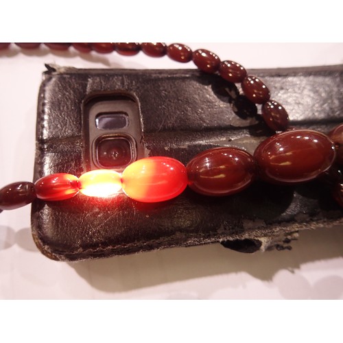 20 - Cherry amber graduated bead necklace, largest bead L: 28 mm, 39g, condition good. UK P&P Group 0 (£6... 